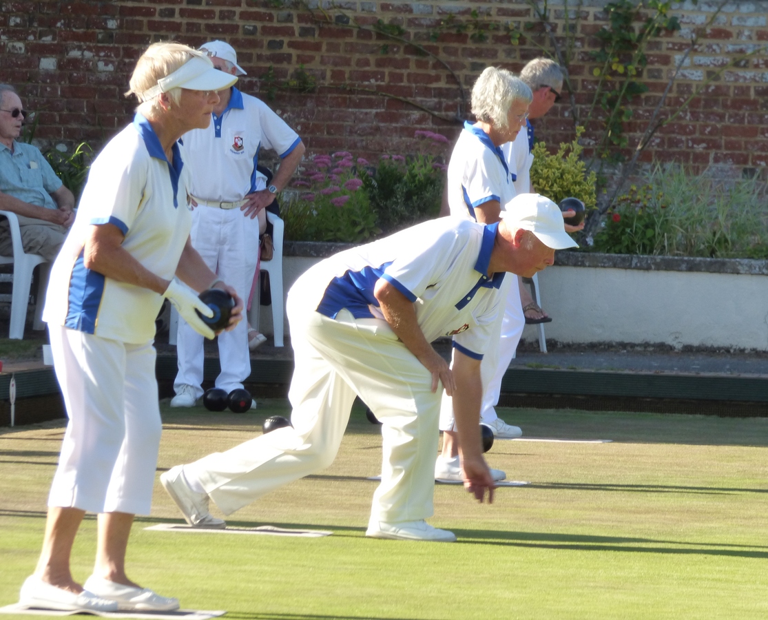 Mike Woolams  in full flight, in between Mags Shelley and Angela Moss.